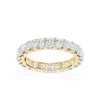 A yellow gold eternity ring set with round brilliant-cut diamonds, shown on a clean white background.