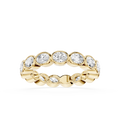A yellow gold eternity ring featuring a row of round-cut clear gemstones in a bezel setting, shown against a plain white background.