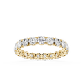 A yellow gold eternity ring featuring a continuous row of round brilliant-cut diamonds set in a polished band, shown against a solid white background.