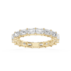 A rose gold eternity ring featuring a continuous line of baguette-cut clear gemstones, shown on a clean white background.
