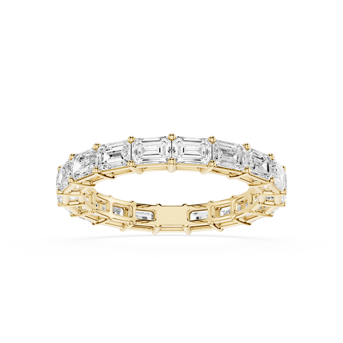 A rose gold eternity ring featuring a continuous line of baguette-cut clear gemstones, shown on a clean white background.