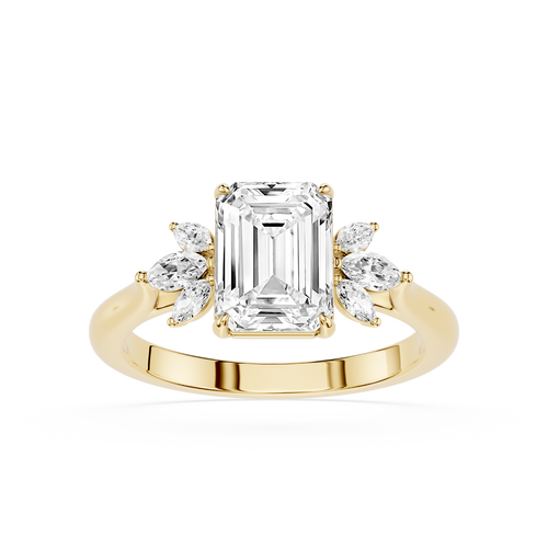 A yellow gold engagement ring featuring a large emerald-cut center diamond flanked by smaller marquise-cut side diamonds, set on a polished band against a white background.