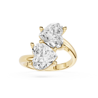 A yellow gold ring featuring two large pear-cut clear gemstones in a split-prong setting, shown on a clean white background.