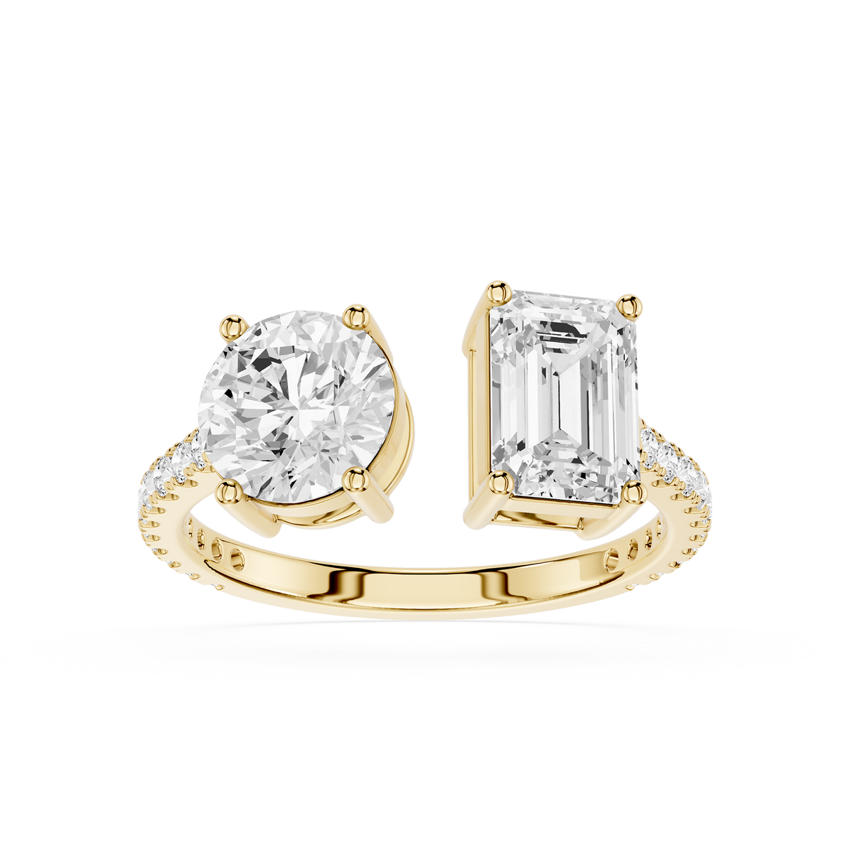 A Toi et Moi ring for her featuring a round brilliant-cut diamond on one side and an emerald-cut diamond on the other, with small pavé diamonds along the gold band.