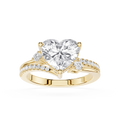 A yellow gold heart-shaped diamond engagement ring with a pavé band, shown on a clean white background.