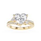 A yellow gold heart-shaped diamond engagement ring with a pavé band, shown on a clean white background.