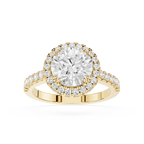 A yellow gold halo ring featuring a round-cut center diamond surrounded by a double halo of smaller diamonds, with a shank paved with small diamonds, shown on a white background.