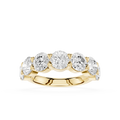A yellow gold five-stone diamond ring with round brilliant-cut diamonds set in a row on a polished band, shown against a solid white background.