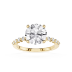 A yellow gold solitaire engagement ring featuring a round brilliant-cut diamond center stone and a pavé band with small round diamonds, set against a plain white background.